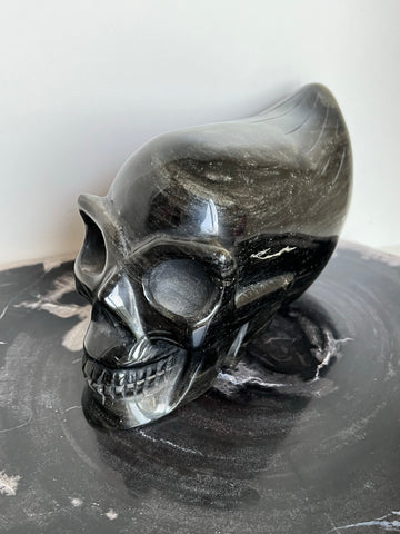 Gouden obsidiaan skull traveller met mooie flash